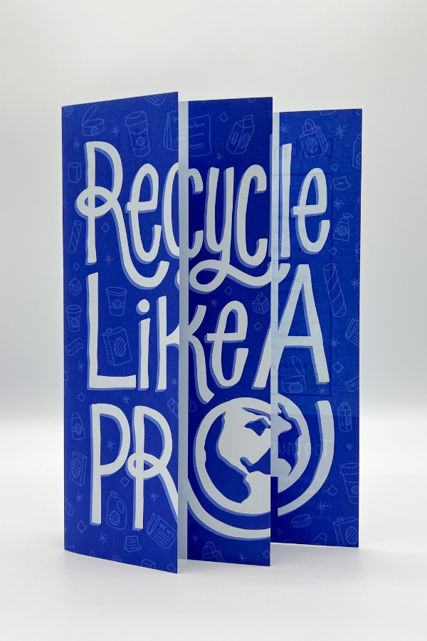 The front cover of a tri-fold brochure promoting recycling in Sechelt, featuring large, playful typography, "Recycle Like A Pro," in a vibrant blue color with white accents.