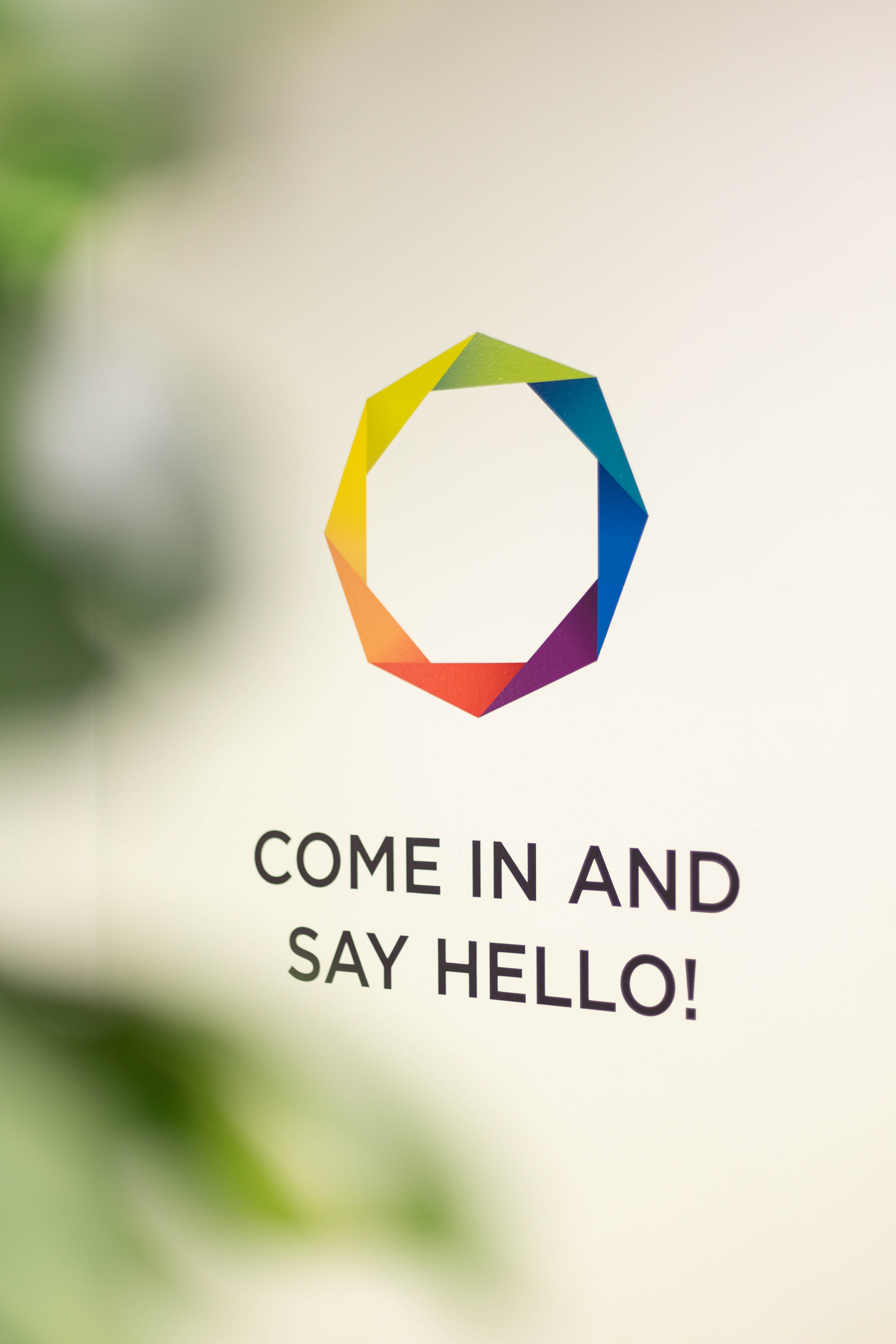 Array Marketing Agency logo on wall with sign that says 