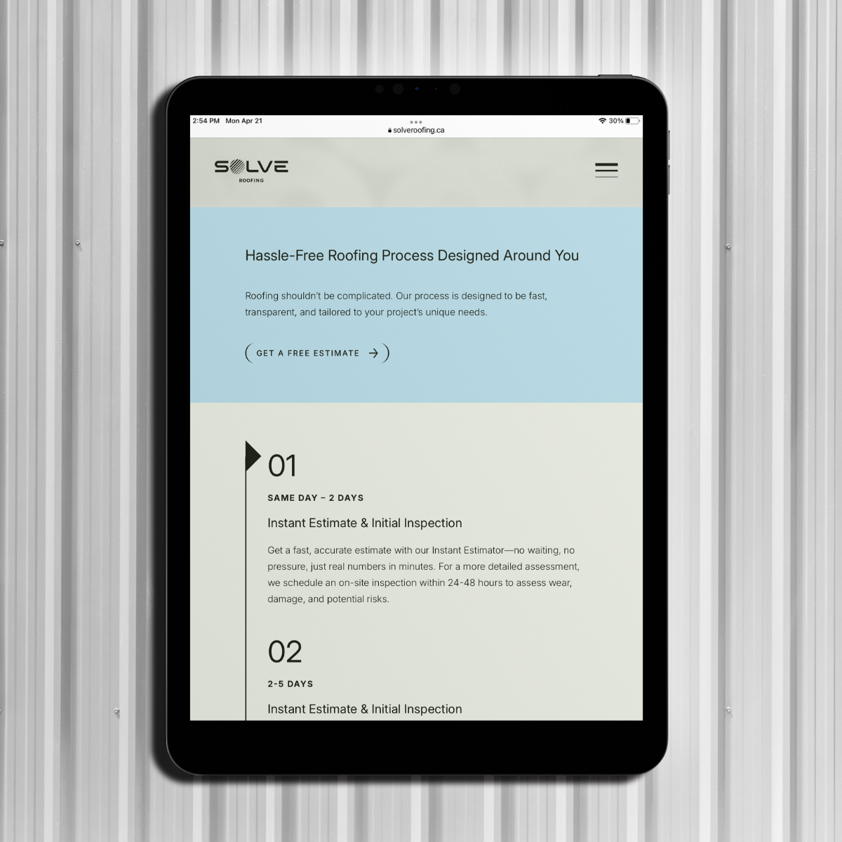iPad displaying the Solve Roofing website. Responsive web design by Array.